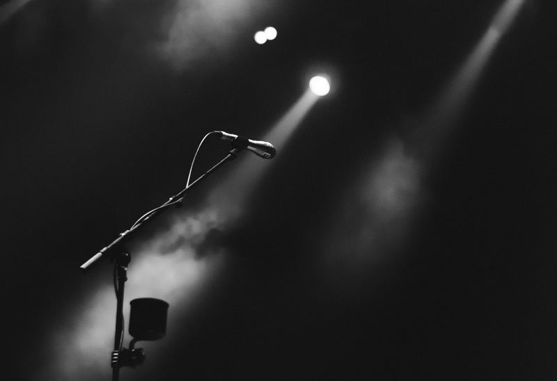 Microphone on a stand under stage lights