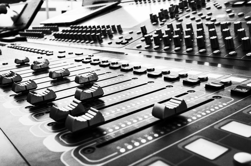 Close-up of faders on a mixing console